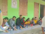 The Deputy Commissioner, Nagaon as External Evaluator having Mid-Day-Meal with Children